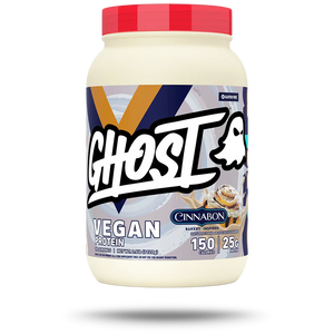A tub of Cinnabon Ghost Vegan Protein powder with a red lid and a white, gray, and blue label, shown on a white background with a soft shadow.